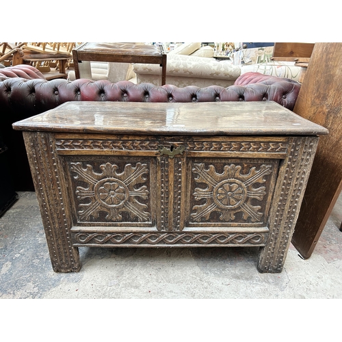 224 - A Charles II carved oak two panel coffer - approx. 59cm high x 95cm long x 48cm deep