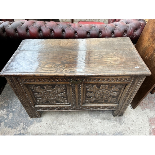 224 - A Charles II carved oak two panel coffer - approx. 59cm high x 95cm long x 48cm deep