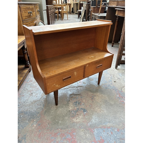 229 - A mid 20th century teak side cabinet with two drawers