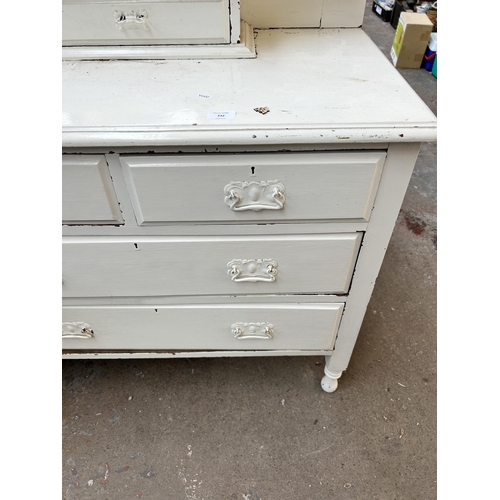 232 - An Edwardian white painted chest of two short over two long drawers