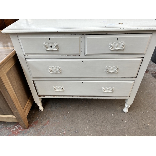 232 - An Edwardian white painted chest of two short over two long drawers