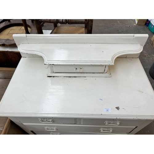 232 - An Edwardian white painted chest of two short over two long drawers