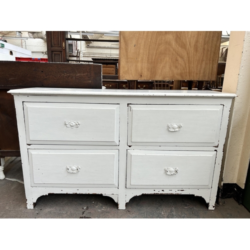 235 - An Edwardian white painted chest of four drawers