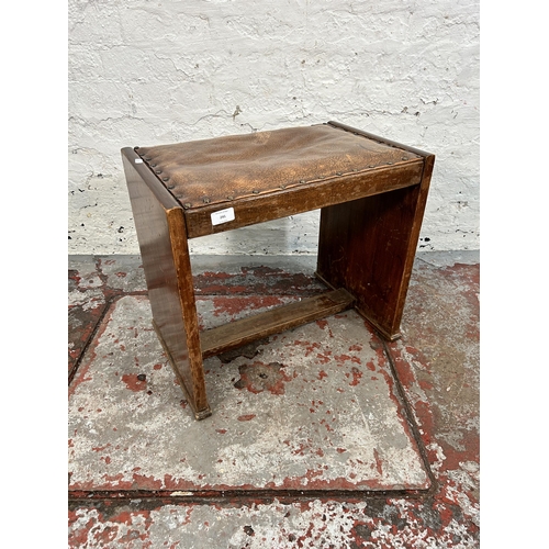 241 - An Art Deco beech and brown leather dressing table stool