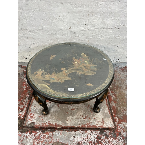 243 - An Oriental hand painted and ebonized circular occasional table with glass top