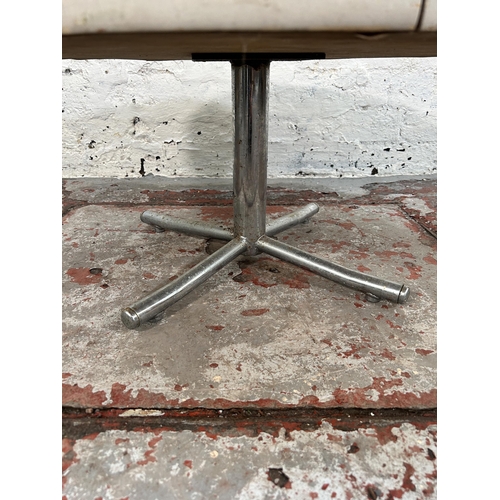 244 - A 1960s white laminate and chrome plated circular occasional table