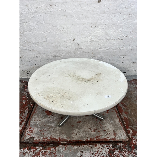 244 - A 1960s white laminate and chrome plated circular occasional table