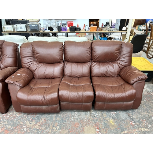 249 - A brown leather three piece lounge suite comprising reclining three seater sofa, electric reclining ... 