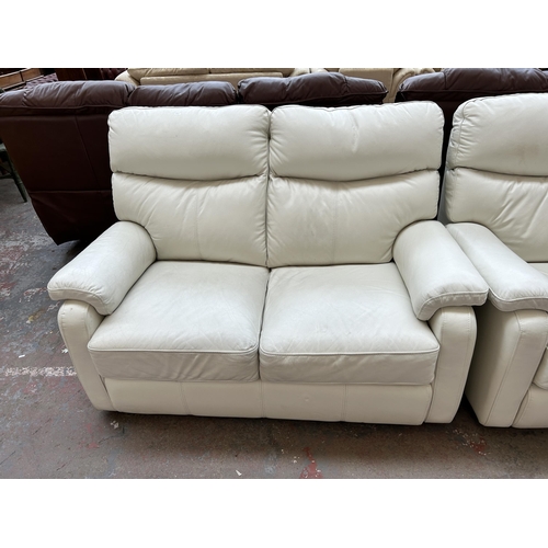 250 - A modern white leather three piece lounge suite comprising two armchairs and two seater sofa