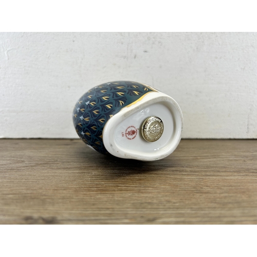 304 - A Royal Crown Derby penguin and chick paperweight with gold stopper - approx. 12.5cm high