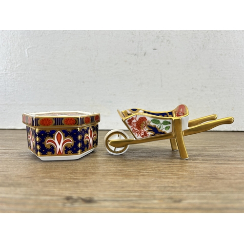 332 - Two pieces of Royal Crown Derby Old Imari bone china, one A1297 trinket box and one miniature wheel ... 