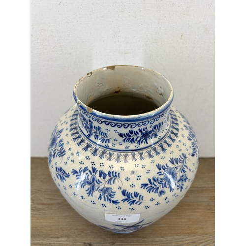 338 - A 19th century Delft blue and white vase - approx. 28cm high