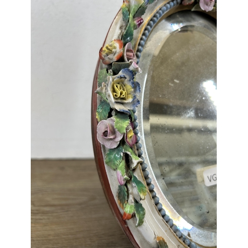 344 - A 19th century Meissen style continental porcelain framed oval bevelled edge easel back mirror - app... 