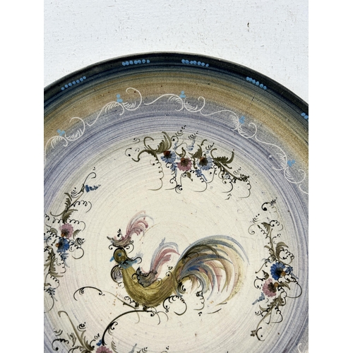 347 - A hand painted ceramic wall charger depicting cockerel signed to reverse - approx. 28cm diameter