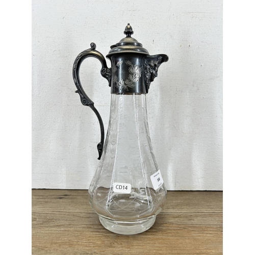 348 - A 19th century style etched glass and pewter claret jug with acanthus leaf design handle and face to... 