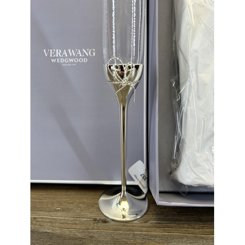 357 - A boxed pair of Vera Wang for Wedgwood Love Knots toasting flutes - approx. 27cm high