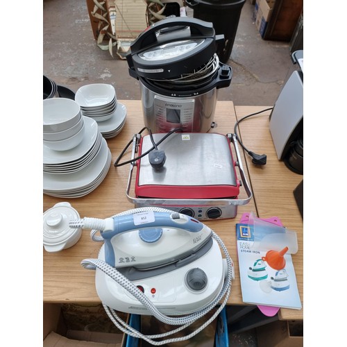 852 - Three home electrical items, one Easyhome steam iron station, one Go Chef 5-in-1 grill and press and... 