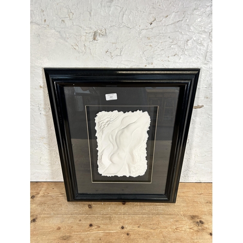 262 - A framed Roberta Peck pencil signed nude man cast paper relief - approx. 60cm high x 51cm wide