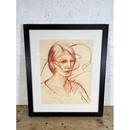 264 - A framed oil pastel portrait of a lady, signed lower left - approx. 79cm high x 66cm wide