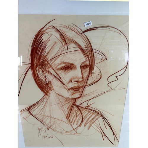 264 - A framed oil pastel portrait of a lady, signed lower left - approx. 79cm high x 66cm wide