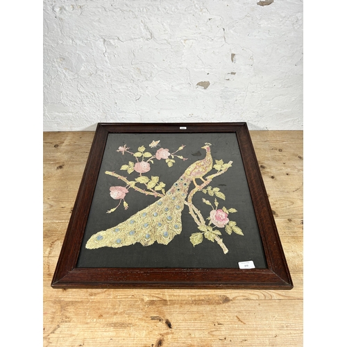 272 - An early 20th century oak framed peacock embroidery - approx. 61cm high x 58cm wide