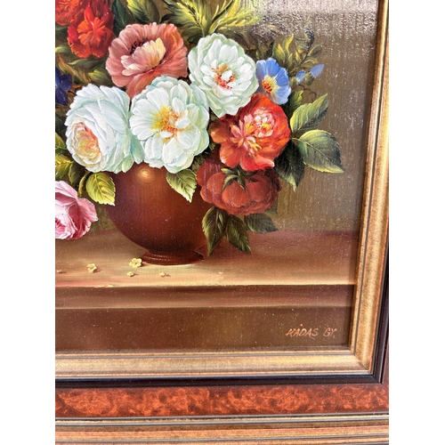 284 - A framed Gyula Kadas floral still life oil on board signed lower right - approx. 44cm high x 38cm wi... 