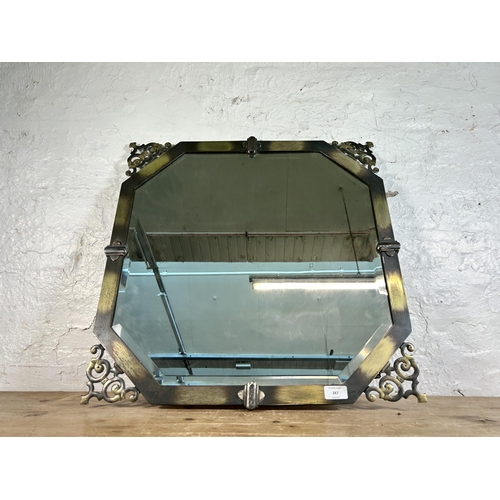 287 - An aged brass framed bevelled edge wall mirror, stamped Rex to reverse - approx. 60cm square