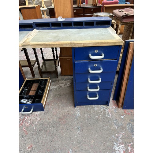 118 - A blue laminate and oak two piece watchmaker's work bench with ten drawers