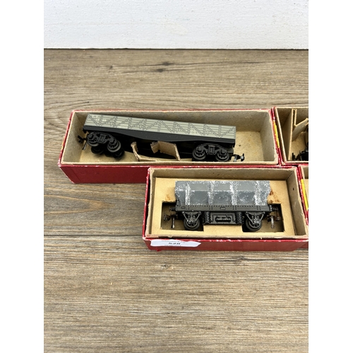 528 - Four boxed mid 20th century Trix twin railway model locomotives, two operating dump wagons, one Gond... 