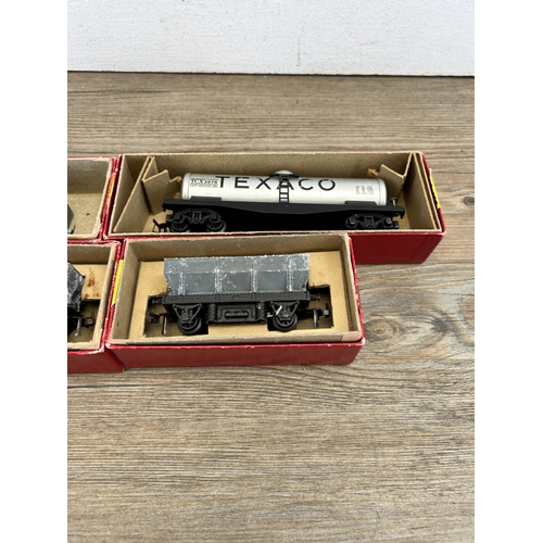 528 - Four boxed mid 20th century Trix twin railway model locomotives, two operating dump wagons, one Gond... 