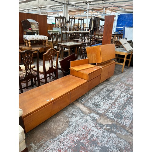 143 - Six pieces of 1970s teak lounge furniture