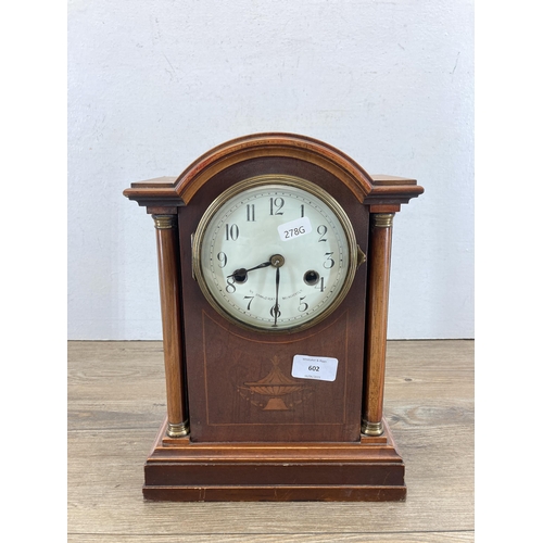 602 - An Edwardian inlaid mahogany cased chiming mantel clock with pendulum and key - approx. 31cm high x ... 