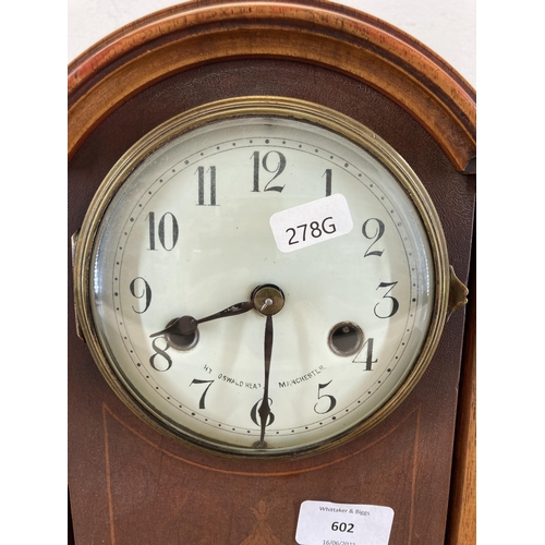 602 - An Edwardian inlaid mahogany cased chiming mantel clock with pendulum and key - approx. 31cm high x ... 