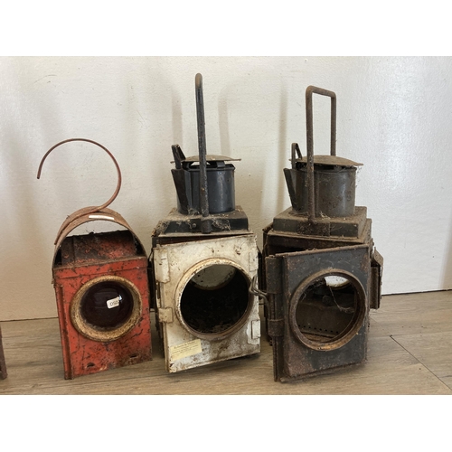 604 - Six vintage metal cased railway lanterns - largest approx. 49cm high