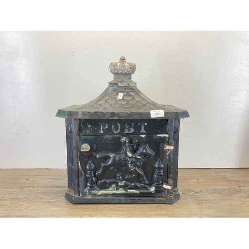 608 - A Victorian style black painted cast iron wall mountable letter box - approx. 44cm high x 41cm wide ... 