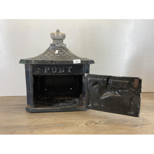 608 - A Victorian style black painted cast iron wall mountable letter box - approx. 44cm high x 41cm wide ... 