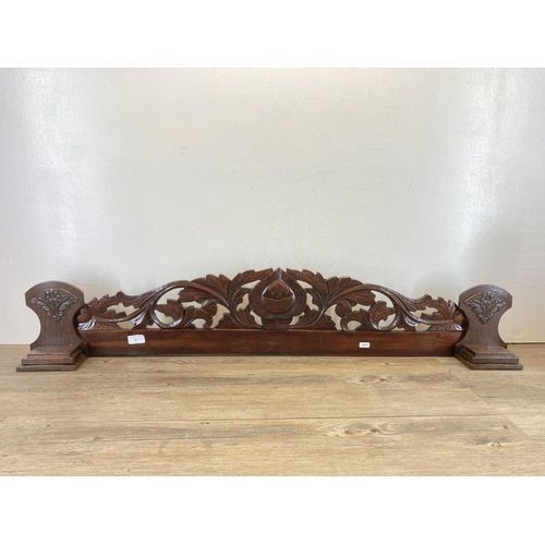 611 - An Edwardian carved mahogany and oak wall panel - approx. 22cm high x 114cm long