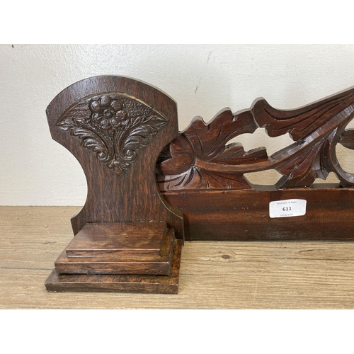 611 - An Edwardian carved mahogany and oak wall panel - approx. 22cm high x 114cm long