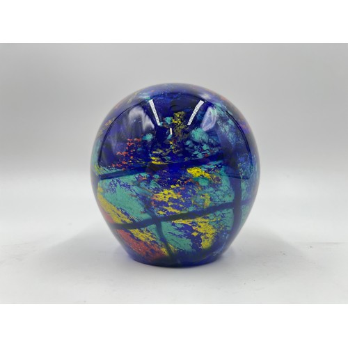 309 - Five art glass paperweights to include three Mdina, Langham Glass etc.