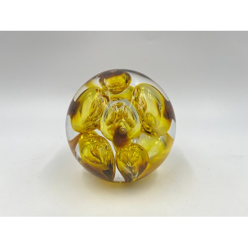 309 - Five art glass paperweights to include three Mdina, Langham Glass etc.