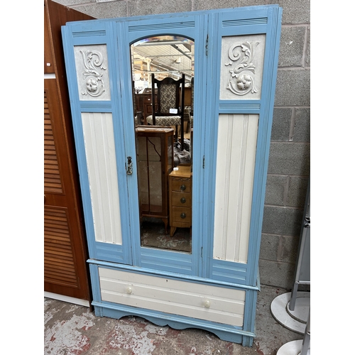 9 - An Edwardian blue and white painted mirrored door wardrobe