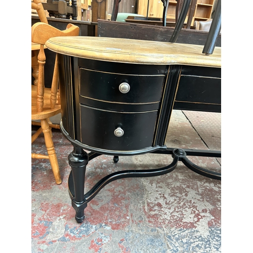 77 - A French Empire style ebonised and oak writing desk with five drawers and rattan seated chair