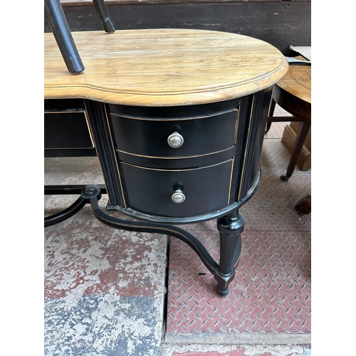 77 - A French Empire style ebonised and oak writing desk with five drawers and rattan seated chair