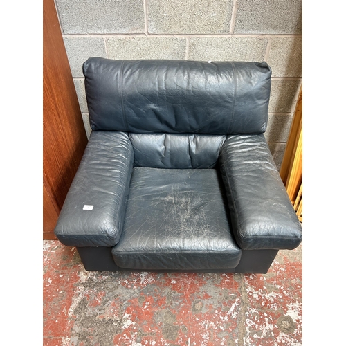 97 - A blue leather armchair