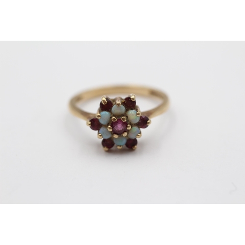 2007 - A 9ct gold ruby and opal floral cluster ring - approx. gross weight 2.6g