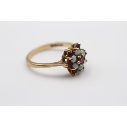 2007 - A 9ct gold ruby and opal floral cluster ring - approx. gross weight 2.6g