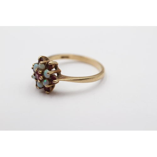 2007 - A 9ct gold ruby and opal floral cluster ring - approx. gross weight 2.6g