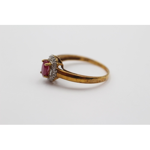 2008 - A 9ct gold ruby and diamond halo ring - approx. gross weight 1.9g