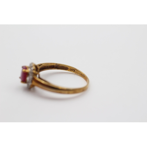 2008 - A 9ct gold ruby and diamond halo ring - approx. gross weight 1.9g