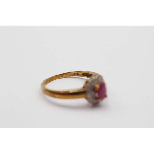 2008 - A 9ct gold ruby and diamond halo ring - approx. gross weight 1.9g